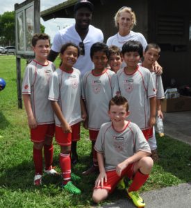 Altidore with Barbara Schulz and a Schulz Academy team